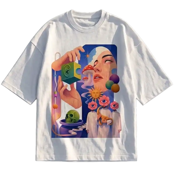A white short-sleeve crewneck t-shirt featuring a large, colorful surreal graphic print on the front. The illustration depicts a woman's face, a hand holding a green puzzle piece, a skull, and abstract cosmic elements in shades of blue, pink, purple, and green.