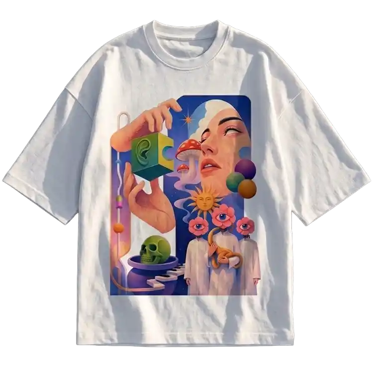 A white short-sleeve crewneck t-shirt featuring a large, colorful surreal graphic print on the front. The illustration depicts a woman's face, a hand holding a green puzzle piece, a skull, and abstract cosmic elements in shades of blue, pink, purple, and green.